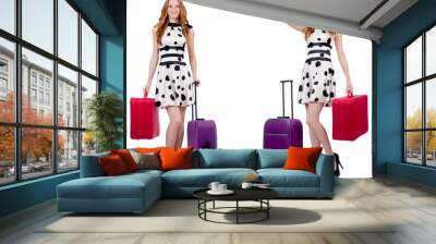 Beautiful woman in polka dot dress with suitcases isolated on wh Wall mural