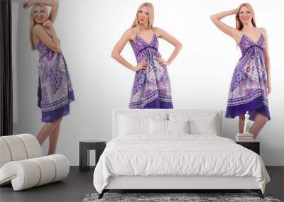 Beautiful woman in purple dress isolated on white Wall mural