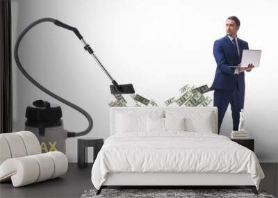 Businessman and vacuum cleaner sucking money out of him Wall mural