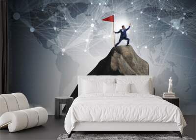 Businessman at the top of mountain  Wall mural