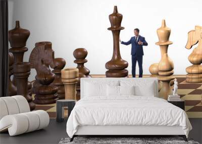 Businessman in large chess board in strategy concept Wall mural