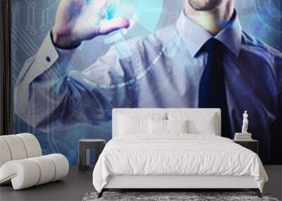 Businessman pressing virtual button in futuristic concept Wall mural