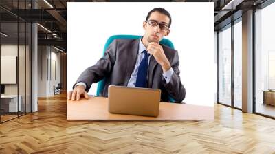 Businessman sitting at the desk Wall mural