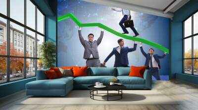 Businessman supporting recovery from economic crisis Wall mural