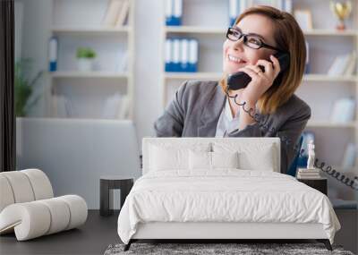 Businesswoman working in the office Wall mural