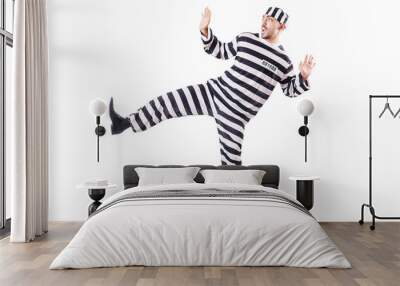 Convict criminal in striped uniform Wall mural