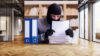 Criminal businessman with balaclava in office Wall mural