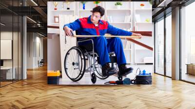 Disabled carpenter taking measurement in workshop Wall mural