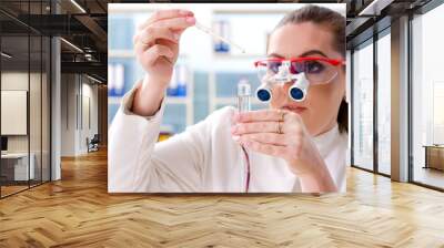 Female biotechnology scientist chemist working in the lab Wall mural