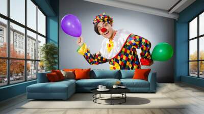 Funny clown in comical concept Wall mural