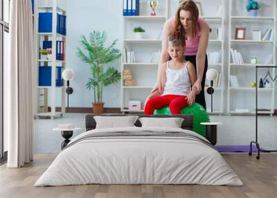 Girl and mother exercising at home Wall mural