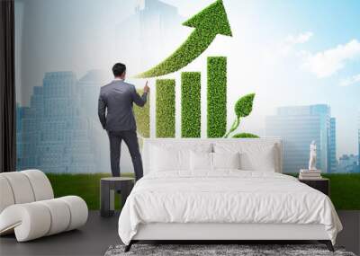 Green economy growth concept with businessman Wall mural