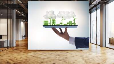 Hand holding tablet with mini ecosystem and clean energy Wall mural