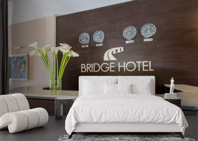 Hotel reception with desk and clocks Wall mural