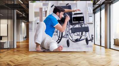 Injured young man recovering at home Wall mural