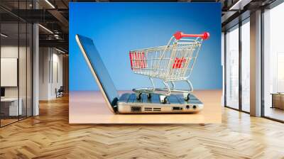 Internet online shopping concept with computer and cart Wall mural