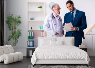 Male doctor and businessman discussing medical project Wall mural