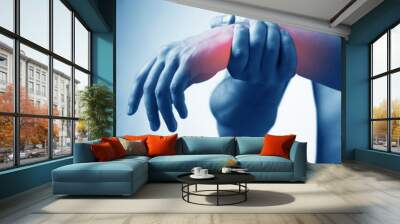 Man suffering from acute pain in wrist Wall mural