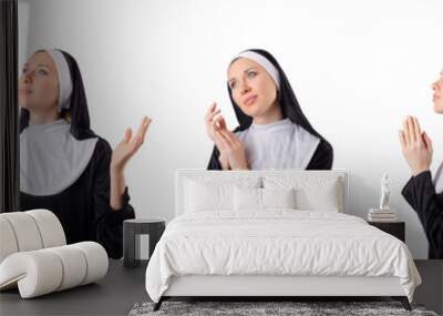 Pretty nun isolated on white Wall mural