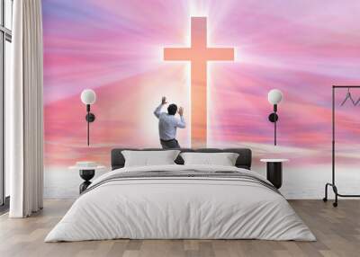 Religious concept with cross and lonely man Wall mural