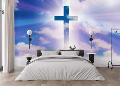 Religious concept with cross and lonely man Wall mural