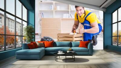 Repairman carpenter working with wooden board plank and measurin Wall mural