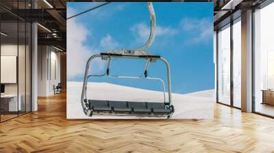 Ski lifts durings bright winter day Wall mural