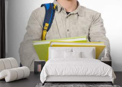 Smiling caucasian student with backpack and books isolated on wh Wall mural