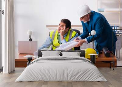 Two male architects working in the office Wall mural