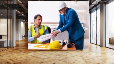 Two male architects working in the office Wall mural