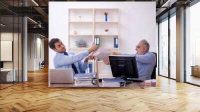 Two male colleagues working in the office Wall mural