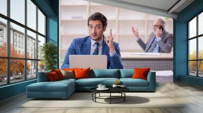 Two male colleagues working in the office Wall mural