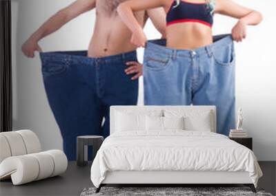 Woman and man loosing weight isolated on white Wall mural