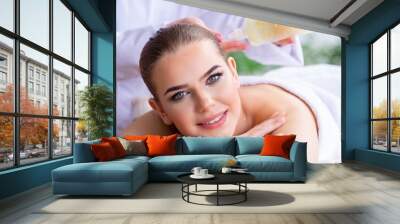 Woman during massage session in spa Wall mural