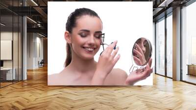 Woman in beauty concept applying make up using cosmetics Wall mural