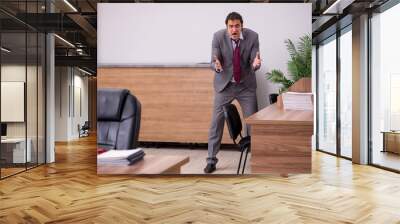 Young businessman employee in bullying concept in the office Wall mural