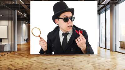 Young detective with pipe and magnifying glass Wall mural