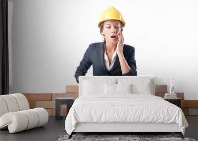 young female builder near brick wall Wall mural