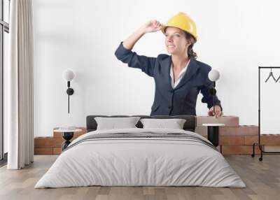 young female builder near brick wall Wall mural