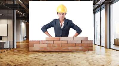 young female builder near brick wall Wall mural