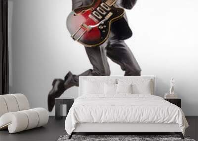 Young guitar player isolated on white Wall mural