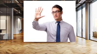 Young handsome businessman pressing buttons isolated on white Wall mural