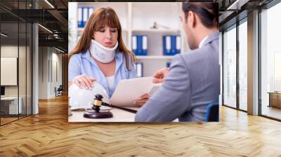 Young injured woman and male lawyer in the courtroom Wall mural