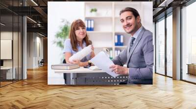 Young injured woman and male lawyer in the courtroom Wall mural