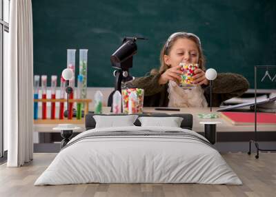 Young little girl chemist in drugs synthesis concept Wall mural