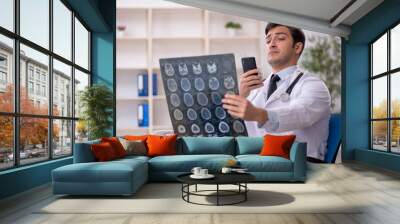 Young male doctor radiologist working in the clinic Wall mural