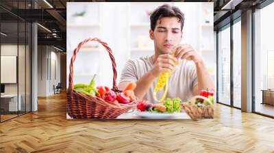 Young man in healthy eating and dieting concept Wall mural