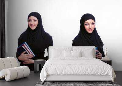 Young muslim woman with book on white Wall mural