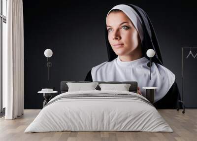 Young nun in religious concept Wall mural