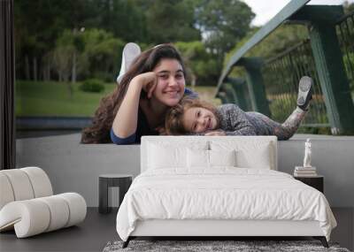 Girls lying in the square Wall mural